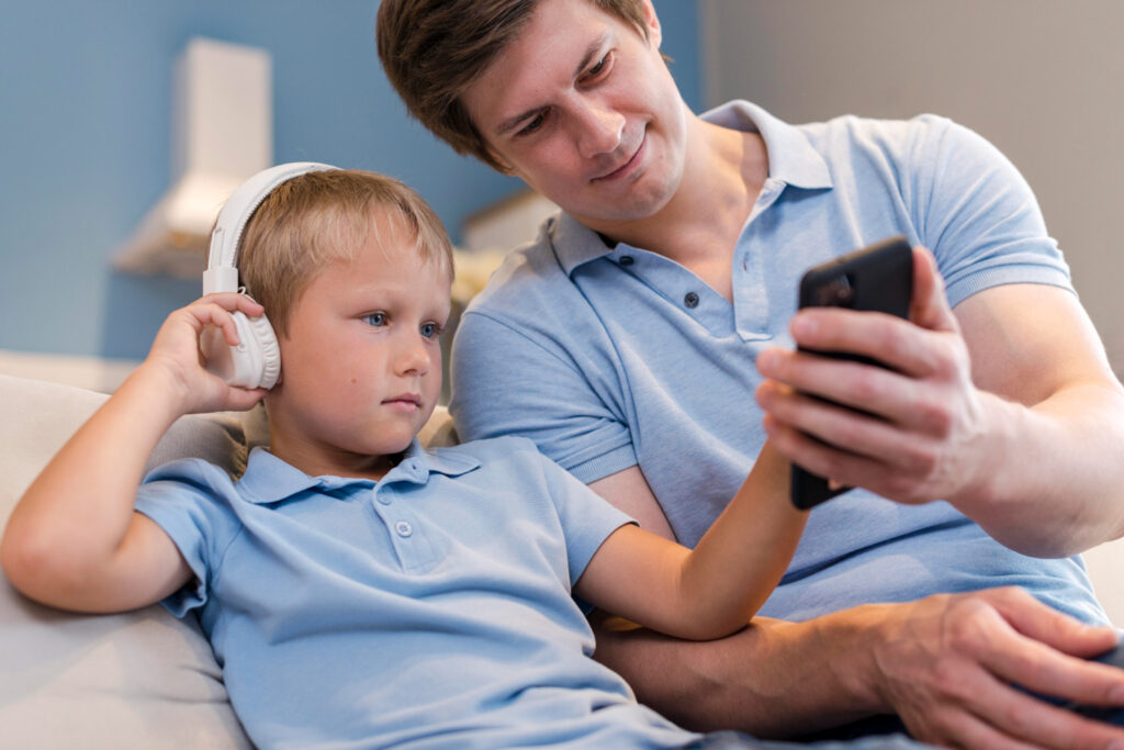 Best Child Safety Apps for iPhone: Parental caring interface showing dad and son